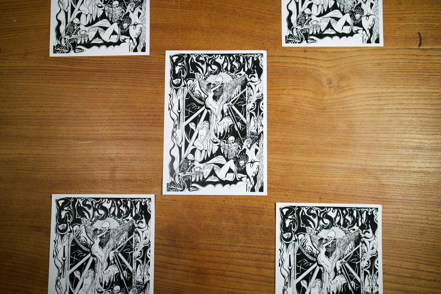 6 A5 prints of  A black and white gothic pen and ink poster for the band black sabbath in an art nouveau style showing a black mass conducted by demons and Skelletons