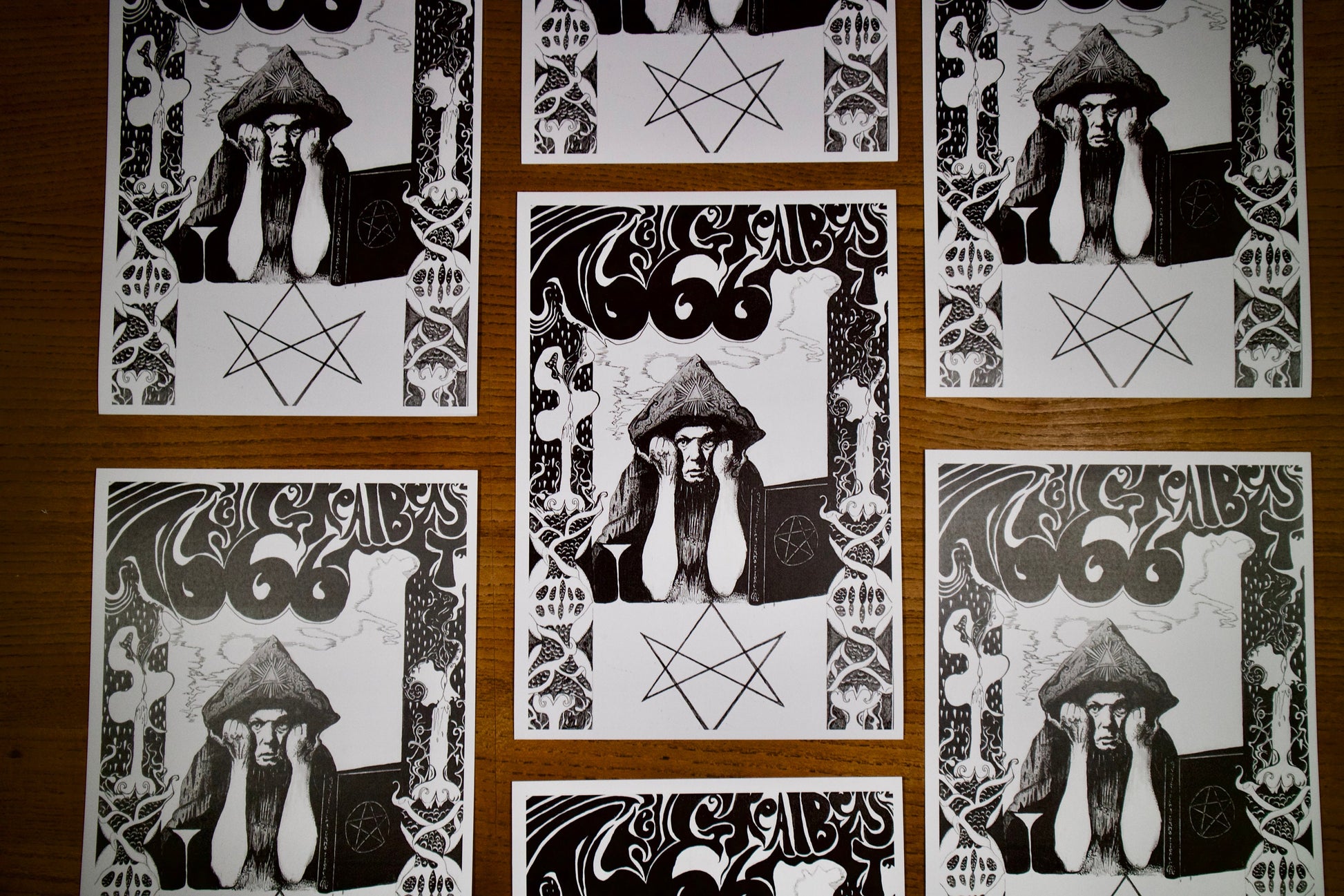 8 prints of A black and white pen and ink portrait of Aleister Crowley in a psychedelic art nouveau style, the text above reads The Great Beast 666